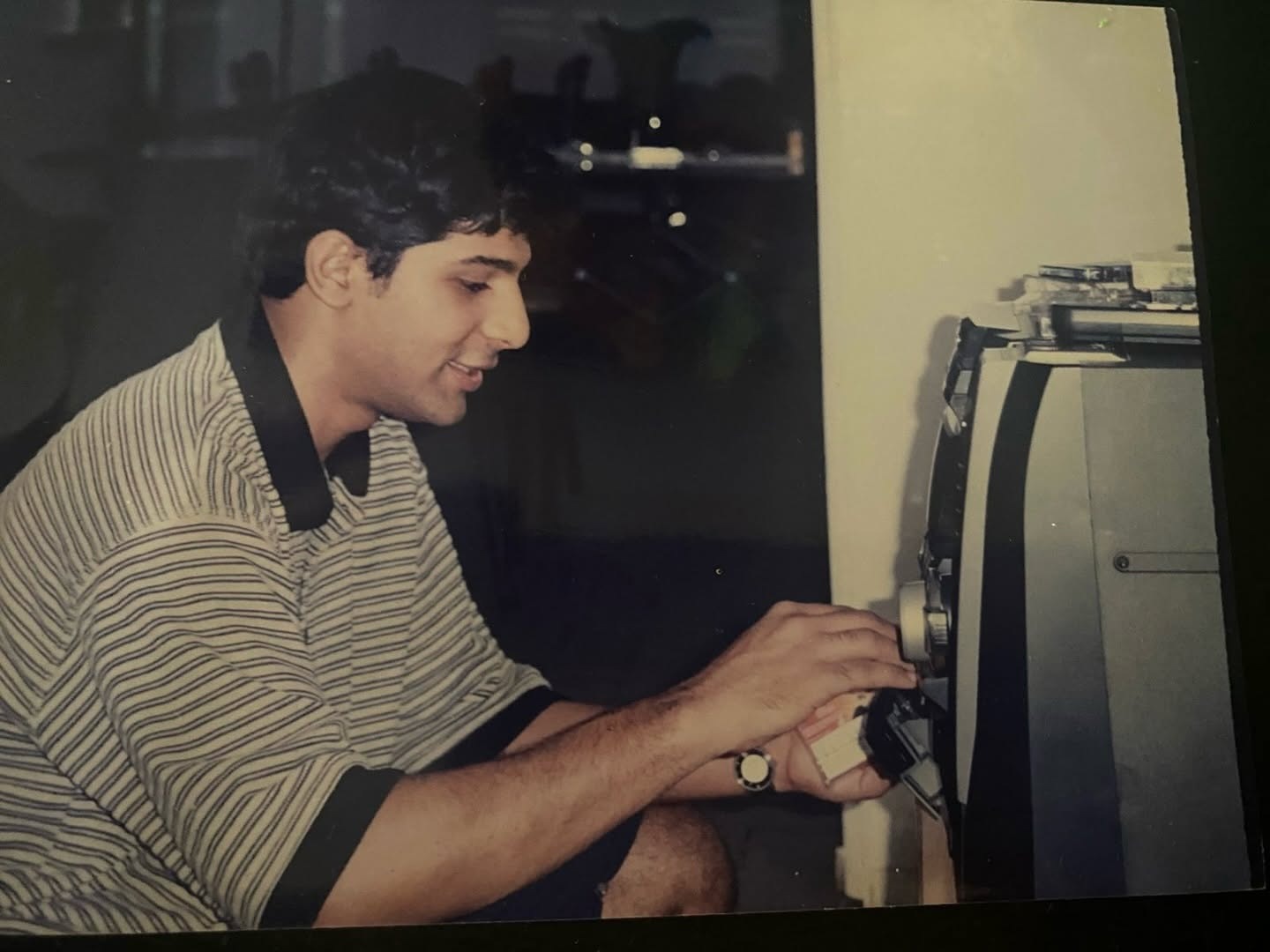 Shuja Haider as a teenager, working at a tape machine