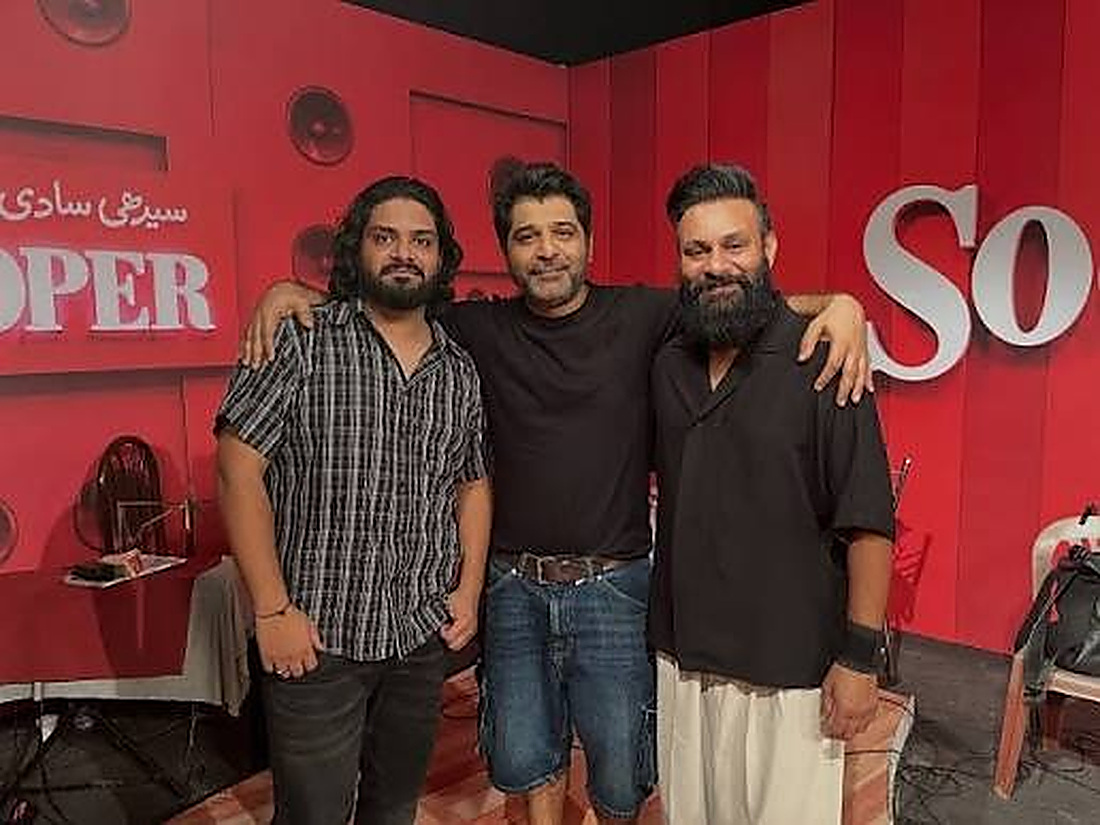 Shuja Haider on set with the production team